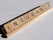 "insurance" spelled with scrabble letters