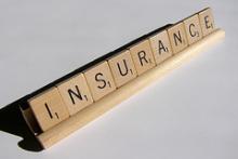 "insurance" spelled with scrabble letters